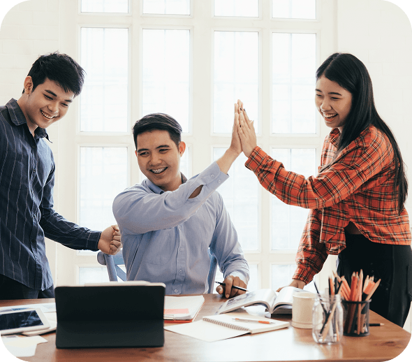 Skillophy team celebrating together in a bright office